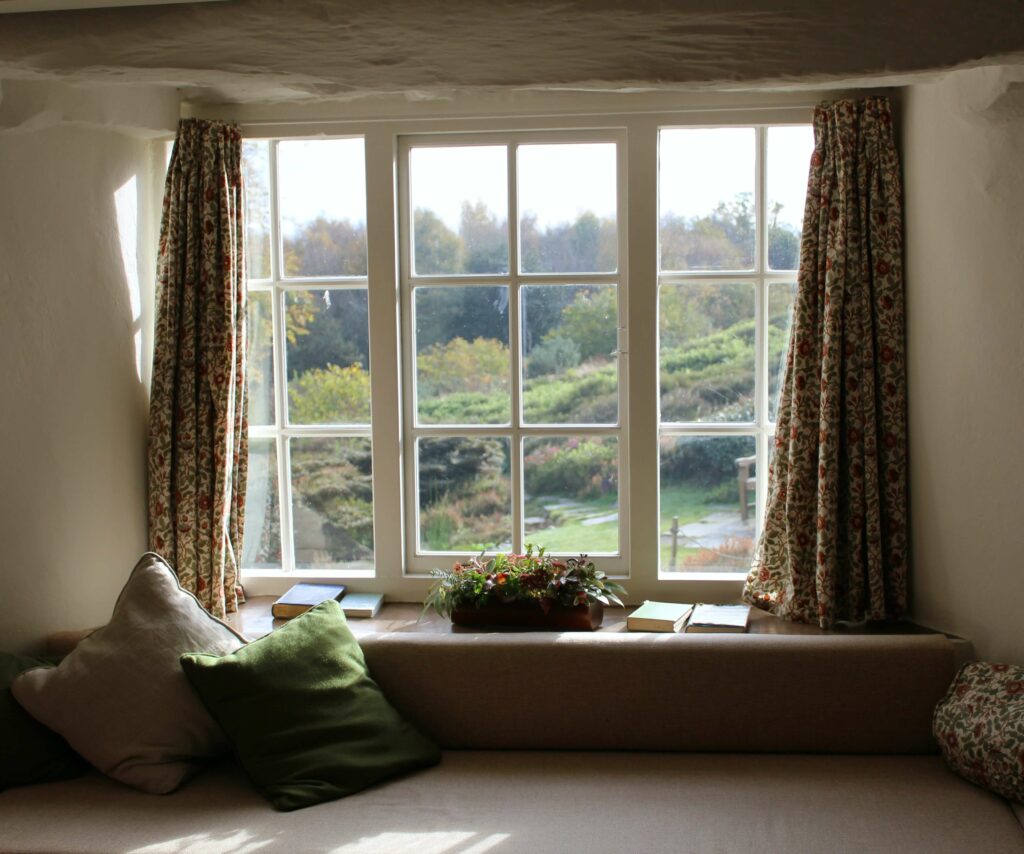 window with patterned heavy curtains