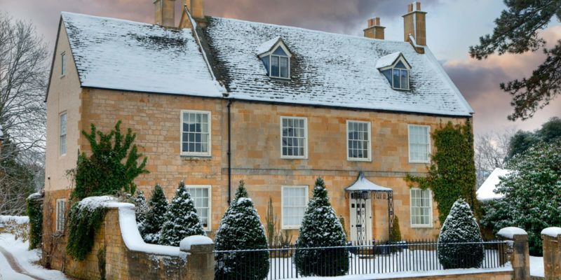 Sash windows on a snowy cottage