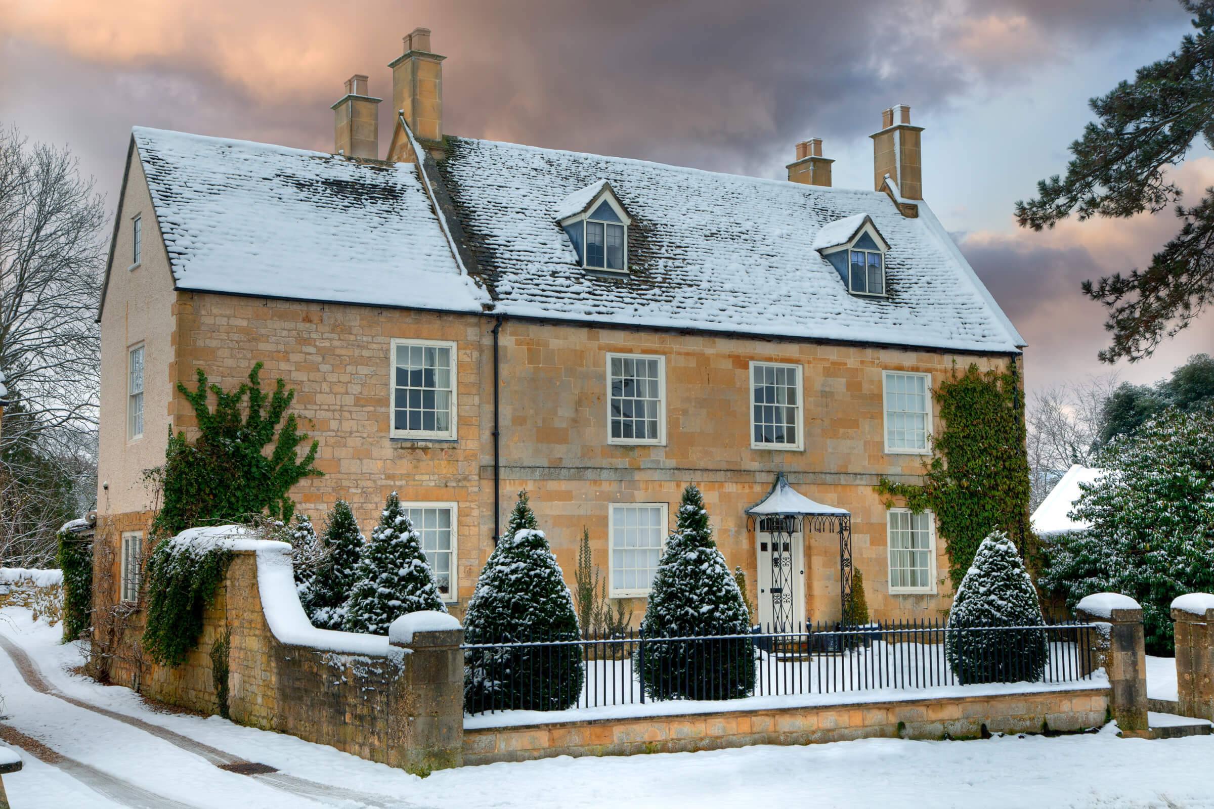 Sash windows on a snowy cottage