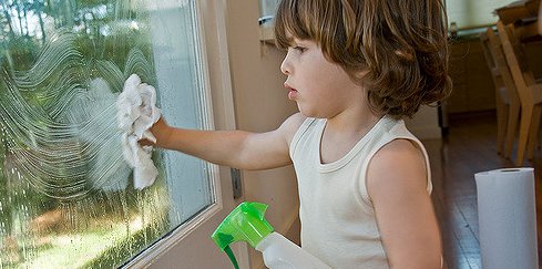 Boy cleaning window