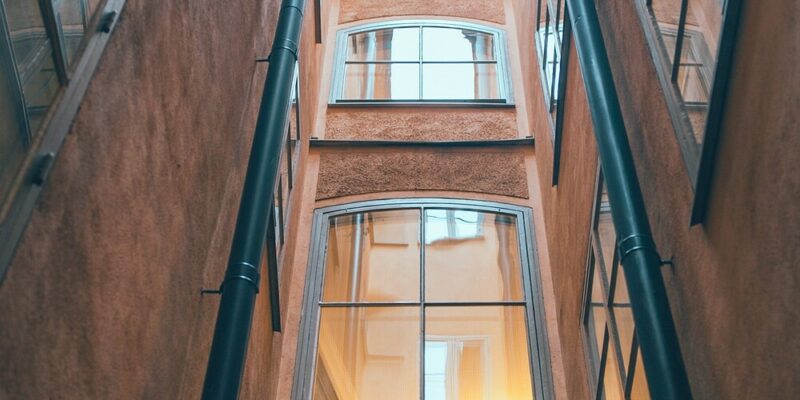 aluminium windows with arched tops on multi-storey building