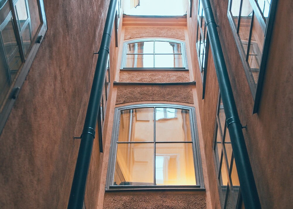 aluminium windows with arched tops on multi-storey building